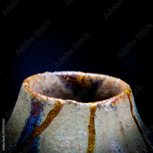 A vase I repaired with gold powder and urushi lacquer with room at the top for text.