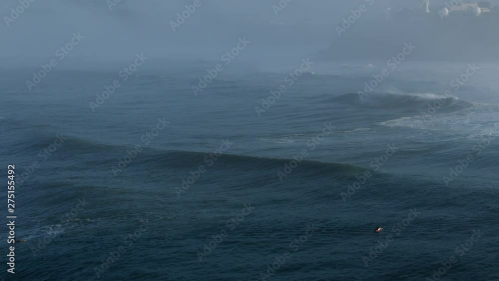 Aerial surfers on surface Pacific Ocean Mavericks America Aerial surfers on surface Pacific Ocean Mavericks America