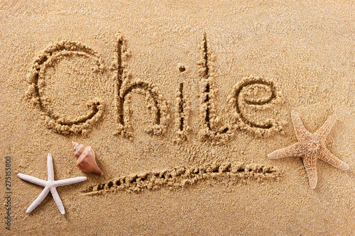 Chile word written in sand on a sunny summer beach with starfish holiday vacation travel destination sign writing message photo