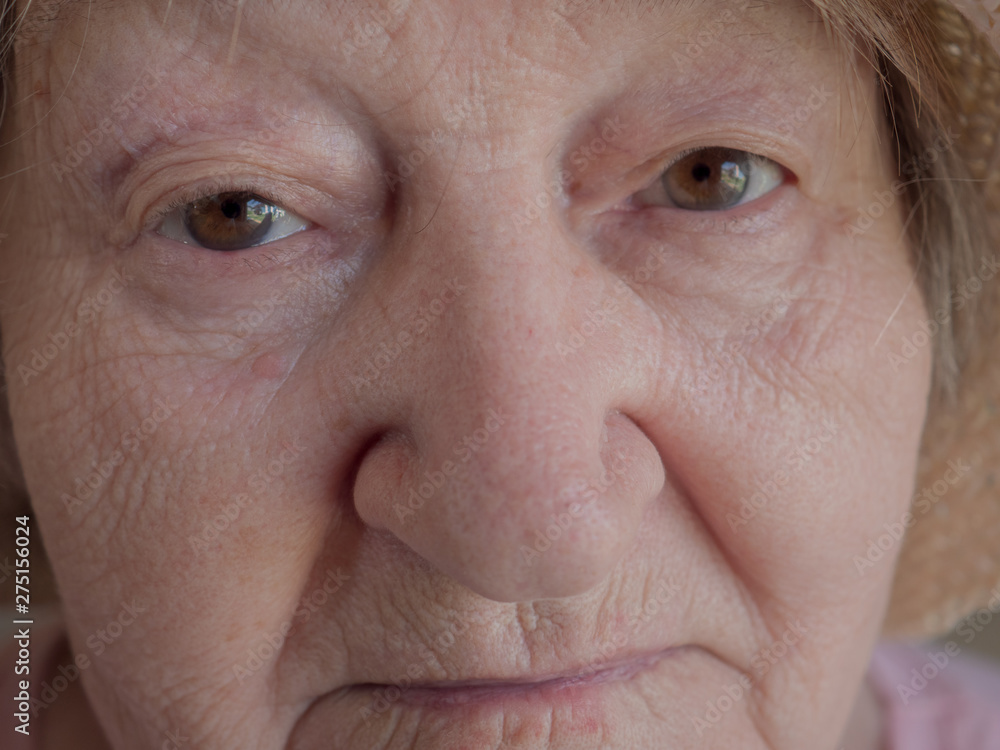 Elderly woman 70 years. Face close up. Eyes, eyebrows, lips, nose. Shallow focus. Village warlock, quack Elderly woman 70 years. Face close up. Eyes, eyebrows, lips, nose. Shallow focus. Village warlock, quack