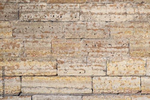 Textural background, brickwork from sandstone bricks.