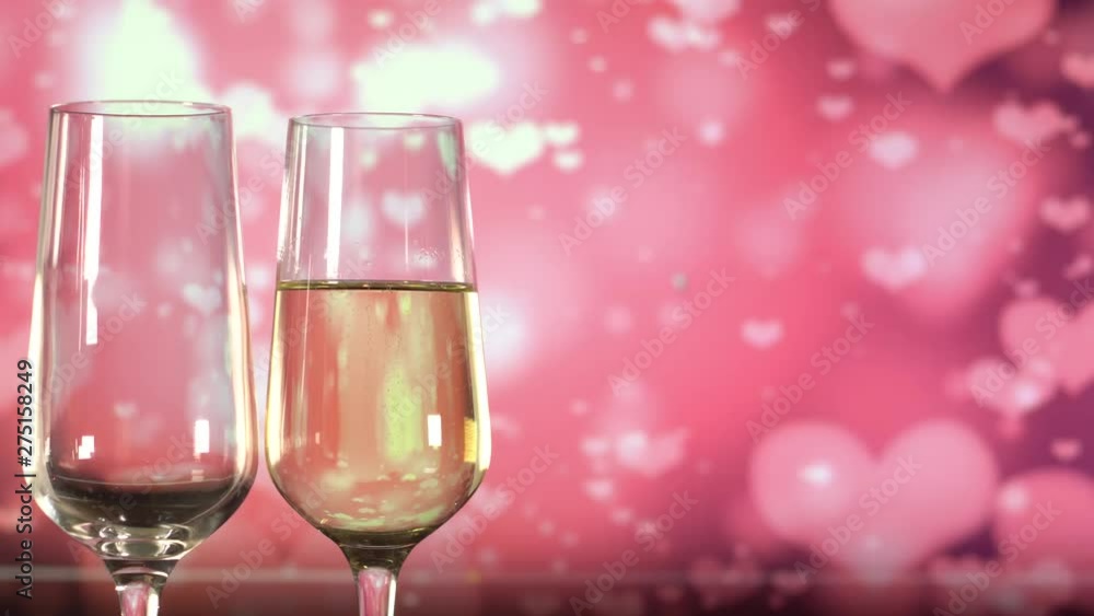 Filling glasses with sparkling wine over abstract pink background. Filling glasses with sparkling wine over abstract pink background.