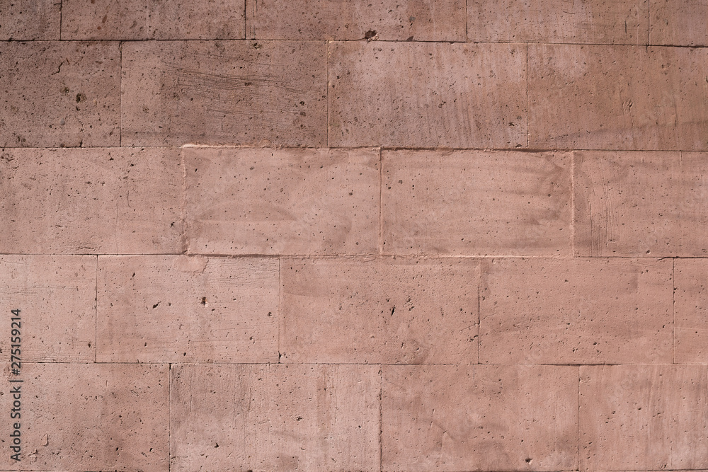 Obraz premium Textured sandstone wall for background and texture