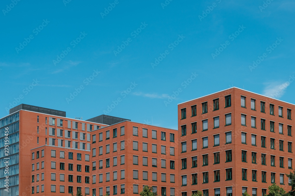  real estate exterior, modern building facade and blue sky