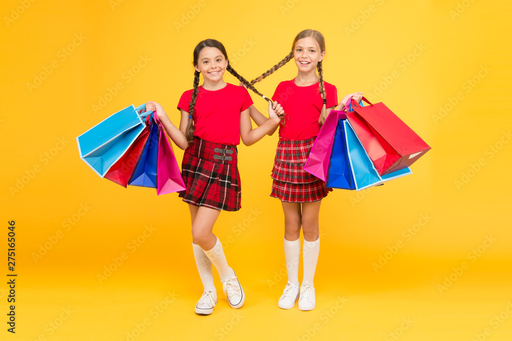 Girls with shopping bags. Rediscover great shopping tradition. Shopping and purchase. Black friday. Sale discount. Gifts and souvenirs. Shopping with friend. Children hold packages. Best day ever Girls with shopping bags. Rediscover great shopping tradition. Shopping and purchase. Black friday. Sale discount. Gifts and souvenirs. Shopping with friend. Children hold packages. Best day ever