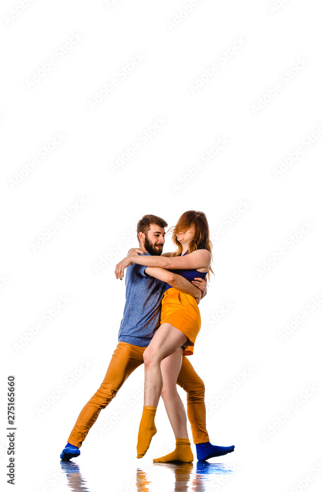 Stunning couple dancing in studio, portrait Stunning couple dancing in studio, portrait