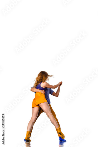 Two young breakdancers in a jumping pose