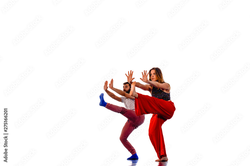 Obraz premium Dancing young couple on a white background