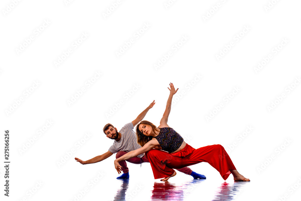 Obraz premium Strong hip-hop boy dance with his partner, isolated on white