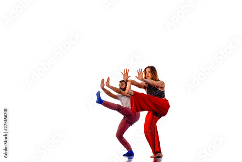 Dancing young couple on a white background