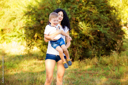 Portrait of happy mother and son smiling