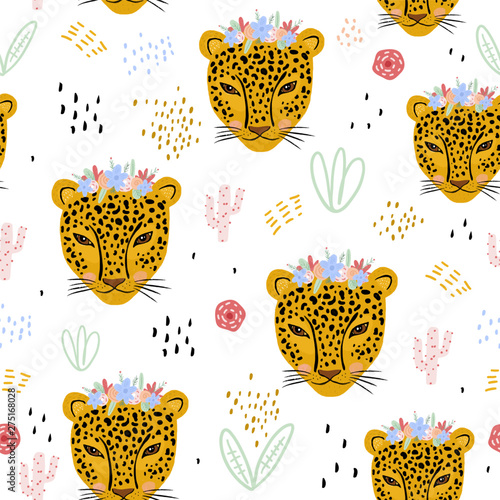 Seamless pattern with cute hand drawn leopard faces. Creative childish jungle background. Perfect for kids apparel,fabric, textile, nursery decoration,wrapping paper.Vector Illustration