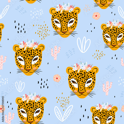 Seamless pattern with cute hand drawn leopard faces. Creative childish jungle background. Perfect for kids apparel,fabric, textile, nursery decoration,wrapping paper.Vector Illustration