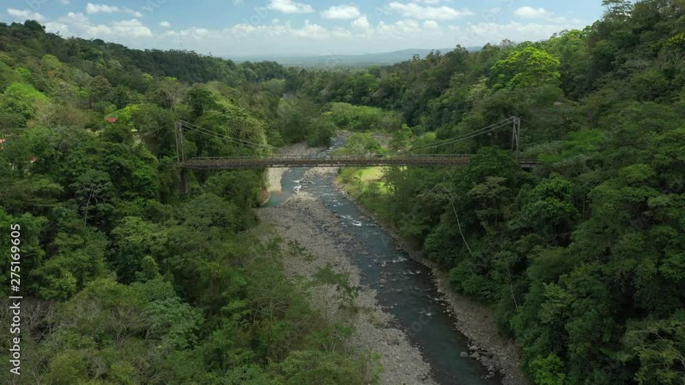 Aerial Drone View over a steel bridge in the tropical rainforest Aerial Drone View over a steel bridge in the tropical rainforest