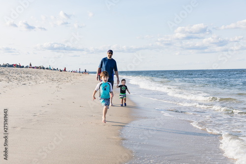Family Walking On The Beach, Father and Children at the Beach