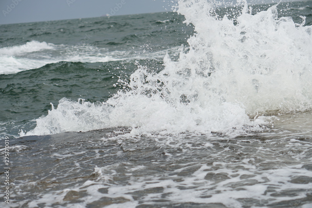 storm, big waves on the coast, splashes of salt water