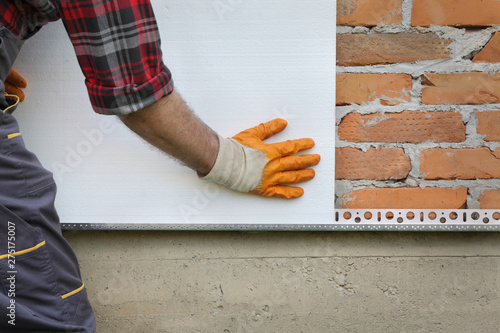 House renovation, polystyrene wall insulation, plate placing