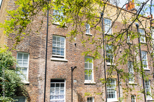 Wallpaper Mural Rear back of Victorian tenements building in red bricks with multiple windows white sash Torontodigital.ca