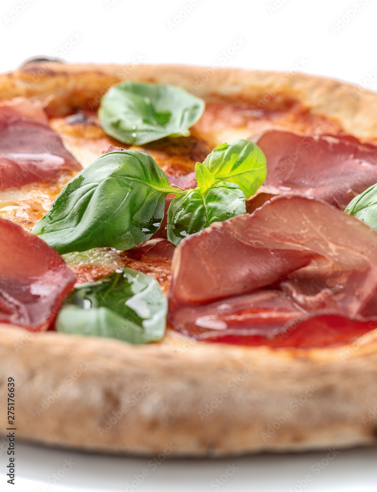 Pepperoni pizza with spinach and bacon on a white plate. Pepperoni pizza with spinach and bacon on a white plate.