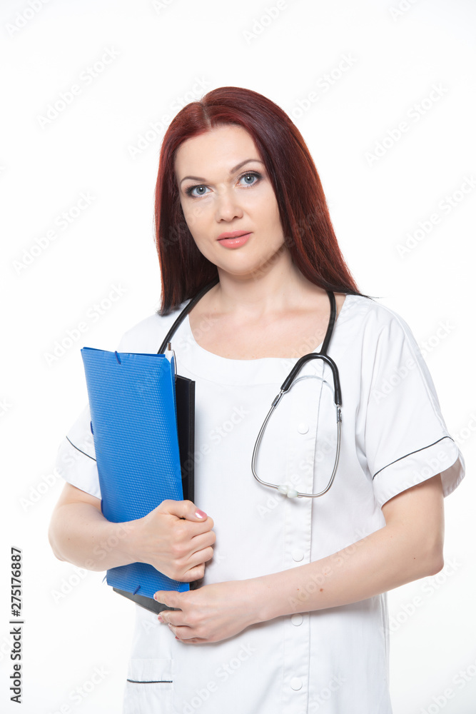 Happy young female family doctor holds blue folder with documents, has friendly expression, isolated white background. Medicine concept. Happy young female family doctor holds blue folder with documents, has friendly expression, isolated white background. Medicine concept.