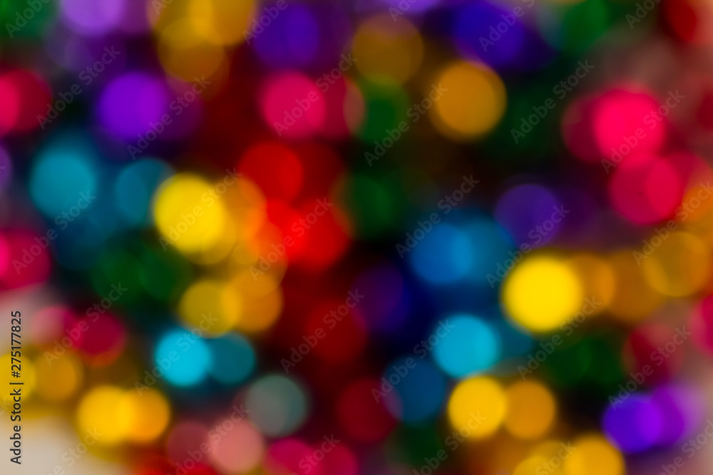 blurred bokeh bright multicolored iridescent glowing gold dimming beads spread on the table background blurred bokeh bright multicolored iridescent glowing gold dimming beads spread on the table background
