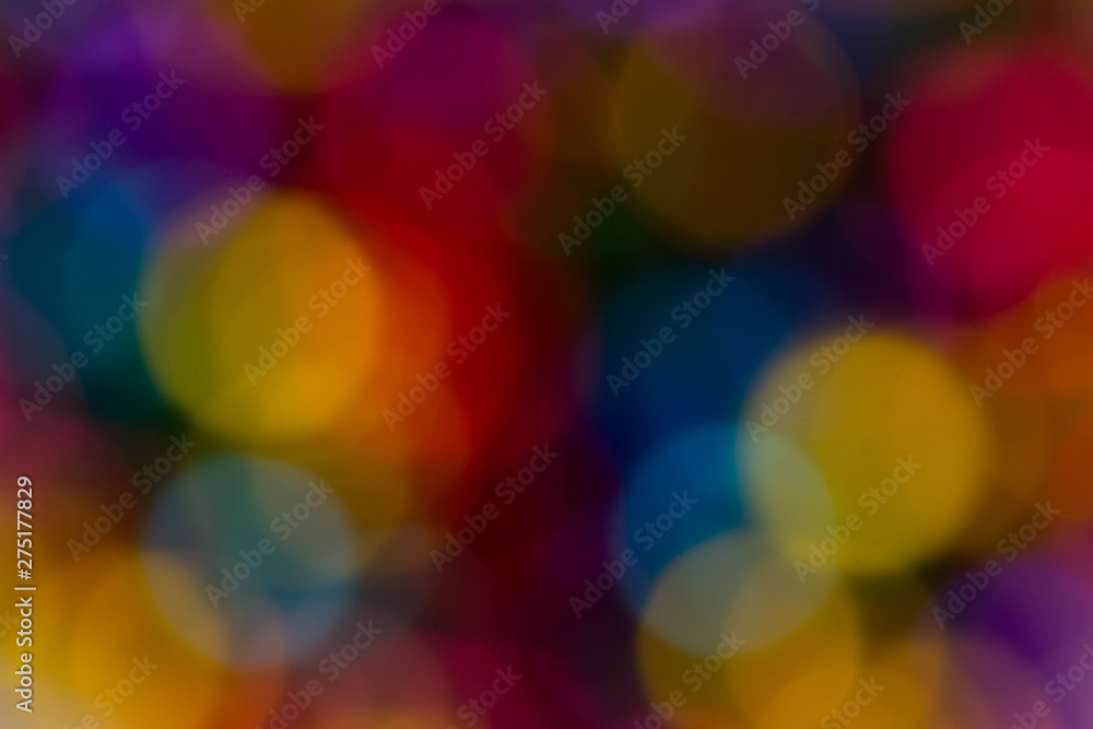 blurred bokeh bright multicolored iridescent glowing gold dimming beads spread on the table background blurred bokeh bright multicolored iridescent glowing gold dimming beads spread on the table background