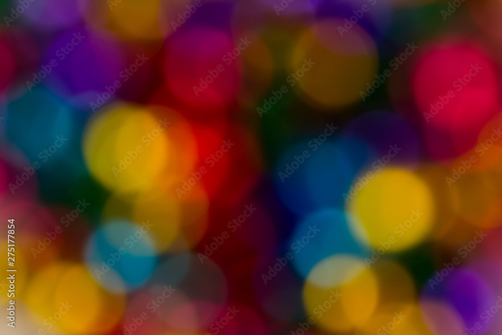 blurred bokeh bright multicolored iridescent glowing gold dimming beads spread on the table background blurred bokeh bright multicolored iridescent glowing gold dimming beads spread on the table background
