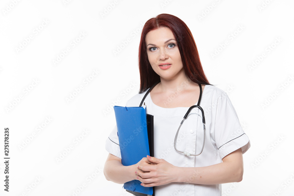 Happy young female family doctor holds blue folder with documents, has friendly expression, isolated white background. Medicine concept. Happy young female family doctor holds blue folder with documents, has friendly expression, isolated white background. Medicine concept.