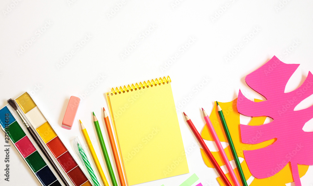 Fototapeta premium School supplies against white background. Flat lay, copy space. Monstera artificial paper leaves
