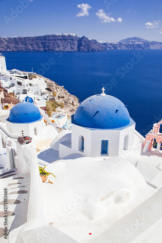traditional blue doomed churches and white houses in Santorini  Cyclades islands Greece - amazing travel destination