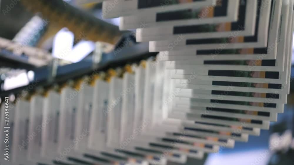 Print plant factory in process. A close-up of a printing machine mechanism.