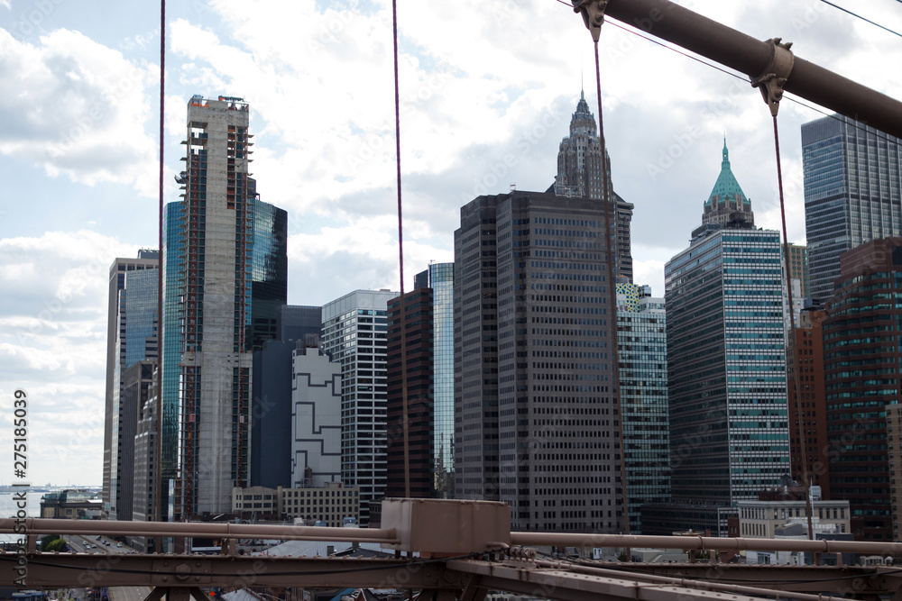 Naklejka premium New York, NY / USA - May/27/2019: View of New York skyscrapers from Brooklyn Bridge