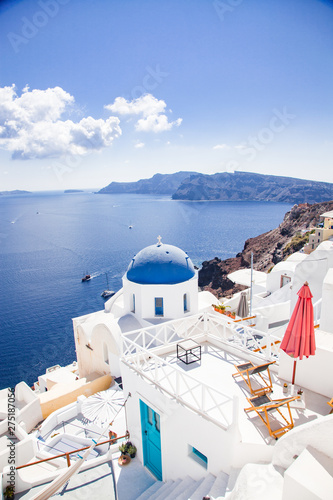 Fototapeta Naklejka Na Ścianę i Meble -  traditional blue doomed churches and white houses in Santorini, Cyclades islands Greece - amazing travel destination