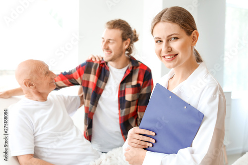 Young man visiting his elde...