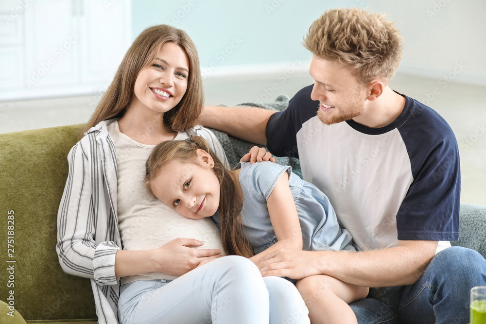 Beautiful pregnant woman with her family at home Beautiful pregnant woman with her family at home