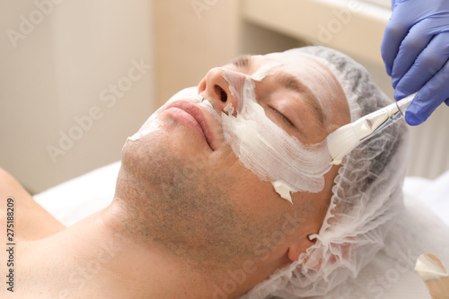 Handsome man undergoing tre...
