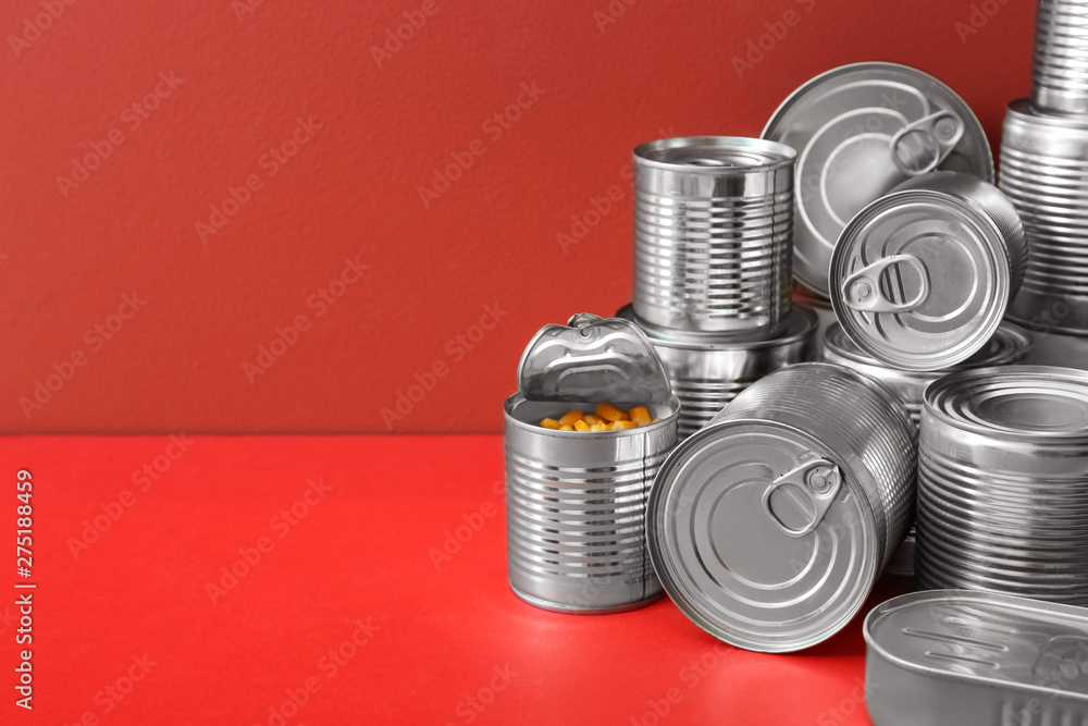 Tin cans with food on color background Tin cans with food on color background