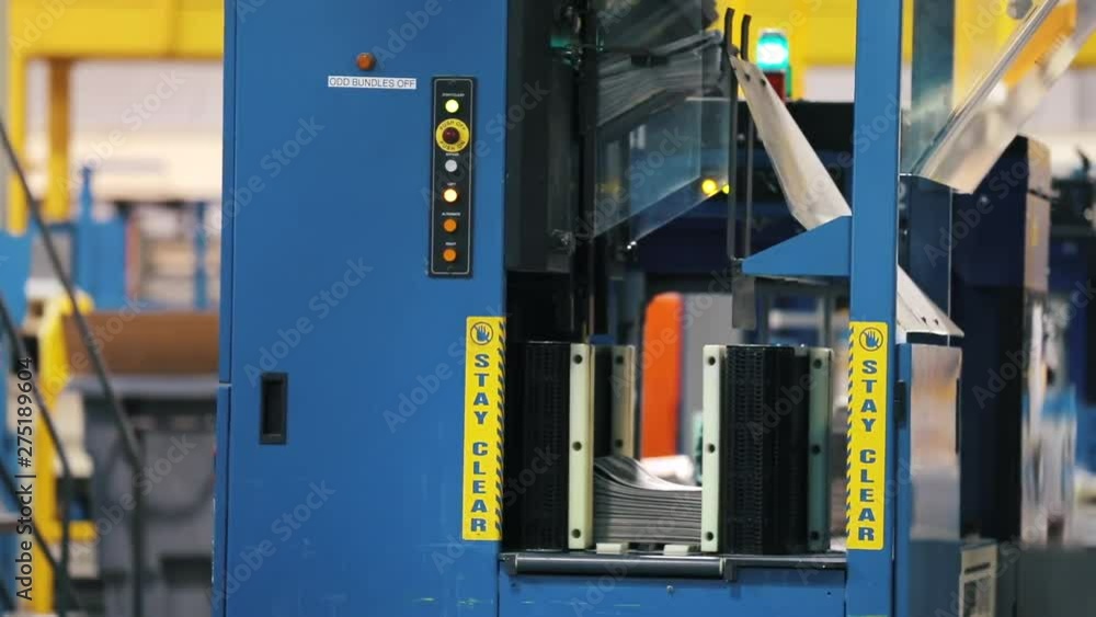 Rollers conveyor belt in process. Print plant factory in process. Rollers conveyor belt in process. Print plant factory in process.