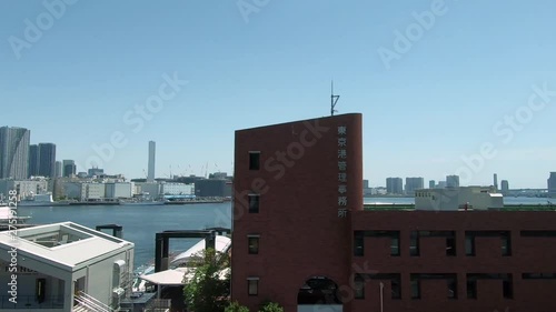 Railway car window. Cityscape with view by the sea photo