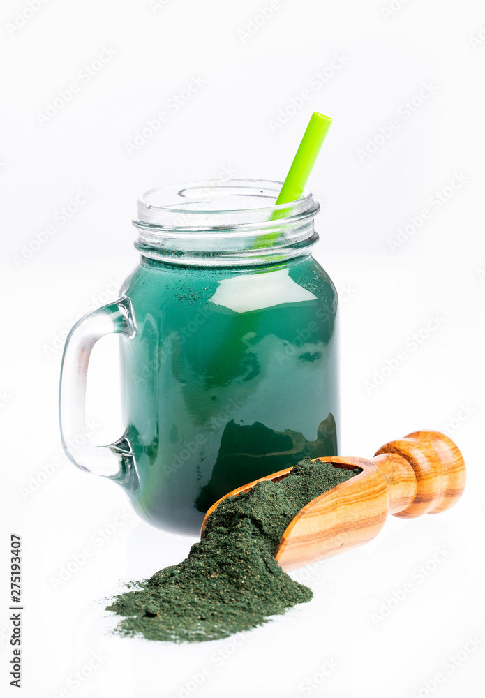 Green Spirulina Smoothie - Concept of food and drink, diet and nutrition. White background Green Spirulina Smoothie - Concept of food and drink, diet and nutrition. White background