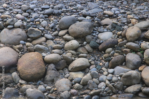 Loads of different colored boulders or pebbles