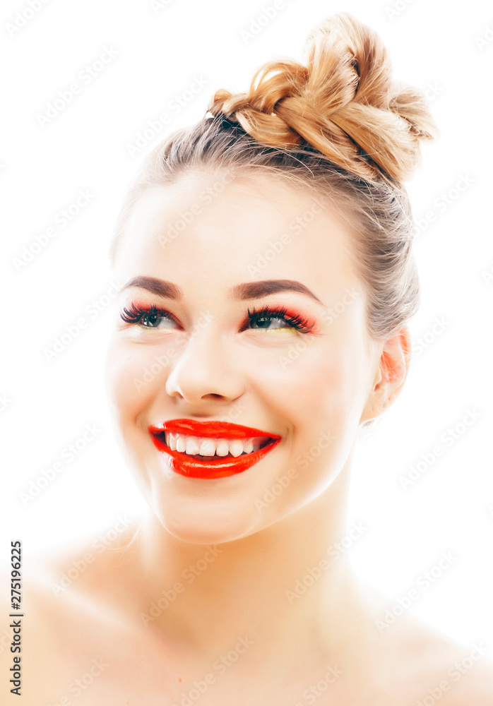 Obraz premium young blond woman with bright make up smiling pointing gesturing emotional isolated like doll lashes on white, real people concept