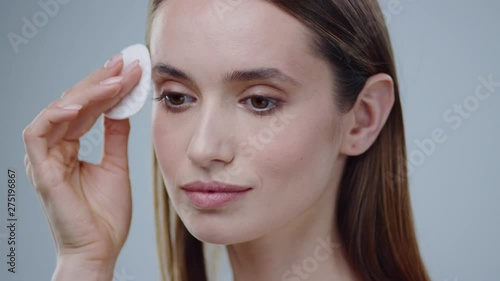 Wallpaper Mural Model woman using cotton pads removing makeup skin care concept clean female makeup portrait beautiful cosmetic foundation health smile beauty perfect care closeup Torontodigital.ca