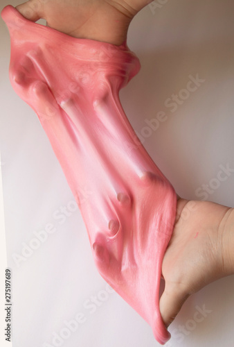 Canvas Print Hands Manipulating Pink Slime Hands pulling, twisting, squeezing slime