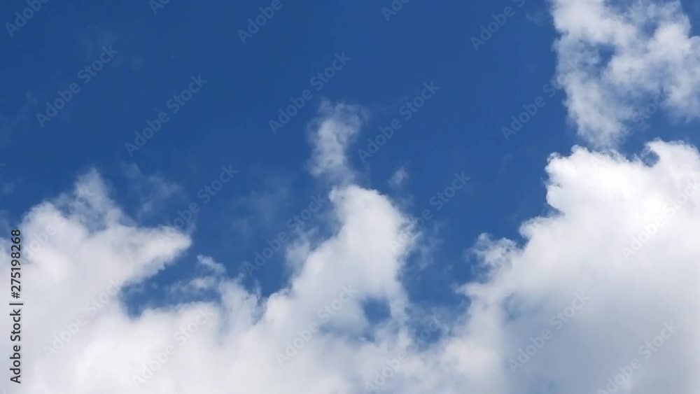 Clouds motion in the blue sky Clouds motion in the blue sky