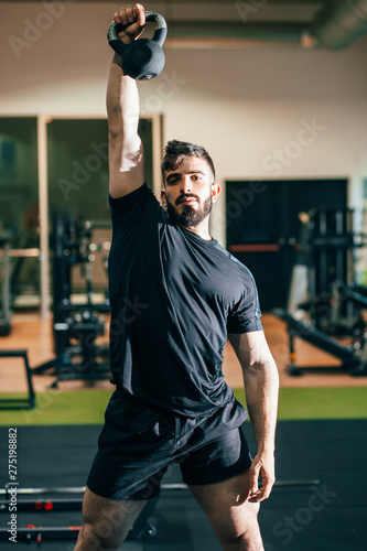 bodybuilder man training in the gym