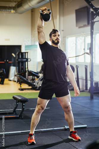 bodybuilder man training in the gym