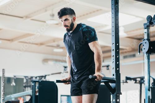 bodybuilder man training in the gym