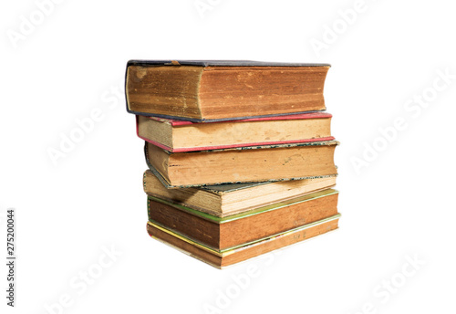 Old books stacked and isolated on white background.