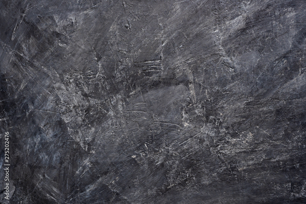 Close up texture of black color painting on cement wall. Close up texture of black color painting on cement wall.